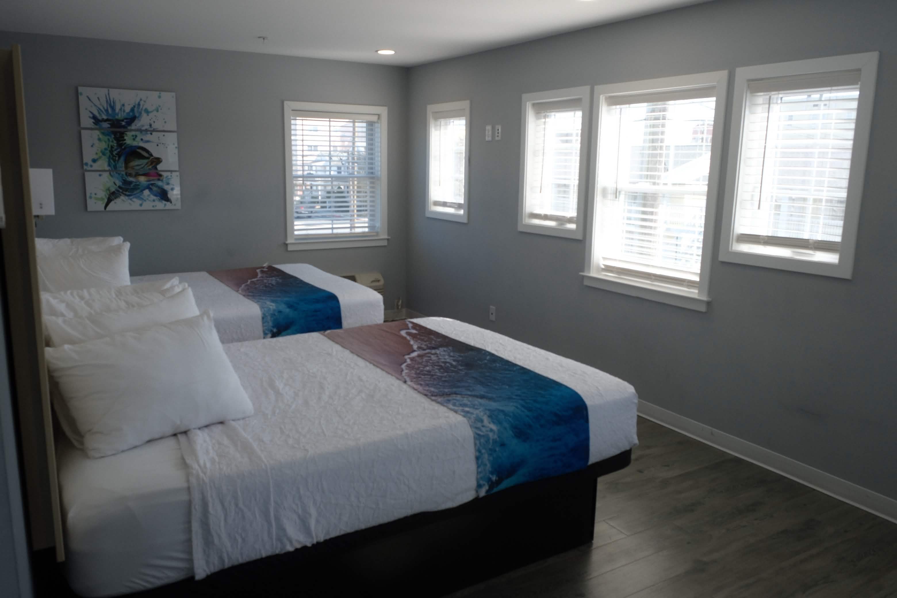 Double queen room with ocean-themed bedding